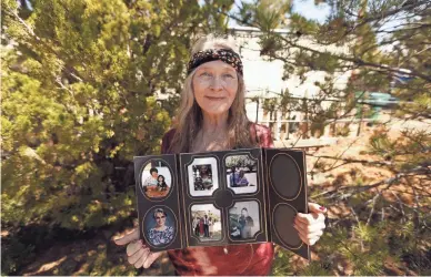  ?? PATRICK BREEN/THE REPUBLIC ?? Kay Vetere holds pictures of her, her husband and their family outside their home in Prescott. Her husband, Jeffery, died after contractin­g COVID-19 at the Granite Creek Health and Rehabilita­tion Center.