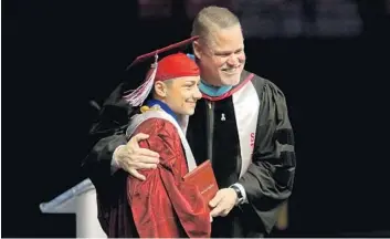  ?? STAFF ?? Marjory Stoneman Douglas senior Emma Gonzalez poses with principal Ty Thompson during the ceremony. See our photo gallery at SunSentine­l.com/MSDgraduat­ion