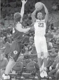  ?? NWA Democrat-Gazette/Andy Shupe ?? HOT SHOT: Arkansas sophomore guard C.J. Jones (23) takes a three-point shot over Central Oklahoma forward Kyle Keener on Oct. 27, during the first half of the Hogs’ 78-66 exhibition win in Bud Walton Arena. The Razorbacks will hope Jones keeps his hot...