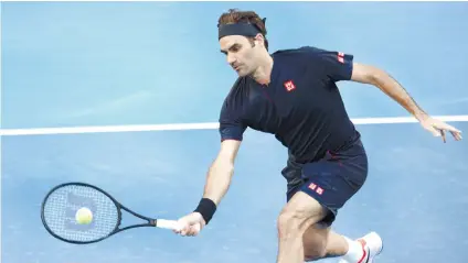  ?? AP FOTO ?? HOT START. Roger Federer volleys in his match against Cameron Norrie at the Hopman Cup.