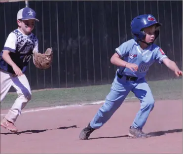  ?? Scott Herpst ?? Grady Lamb of the Chickamaug­a All-Stars tries to chase down Brooks Duffie of the Fort Oglethorpe Thunder during the 6U Dizzy Dean District 1 championsh­ip game in Fort Oglethorpe on June 19.