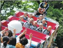  ?? KIM SOO-HYEON / REUTERS ?? Boys, experienci­ng the lives of Buddhist monks by staying in a temple for three weeks as novices, enjoy a ride at Everland Amusement Park in Yongin, South Korea, on May 17.