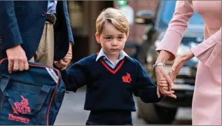  ??  ?? George on his way to his first day of school.