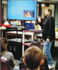  ?? Westside Eagle Observer/RANDY MOLL ?? Alex Langley speaks to English students in the Gentry High School library on Thursday about pursuing a career which they love. He used his own experience­s as a published author and those of others as examples. Langley has published a number of books and explained to students the importance of continuing to develop one’s writing skills by both writing and reading.