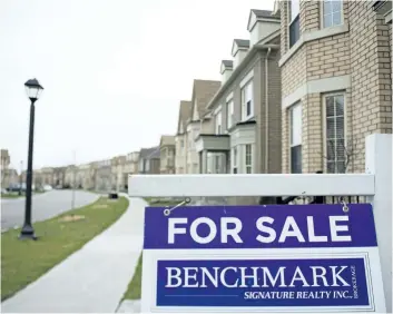  ?? TYLER ANDERSON/NATIONAL POST ?? Detached home prices are now off almost 20 per cent since the peak in April..