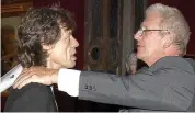  ??  ?? Old pals: Gibbs and Jagger embrace