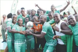  ??  ?? Caps United celebrate after winning the ZNA Commander’s Charities Shield