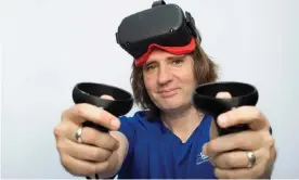  ??  ?? Stuart Dredge tries out virtual reality boxing kit. Photograph: Sophia Evans/The Observer