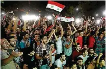  ?? LOUAI BESHARA / AFP ?? Festa. Sírios em Damasco comemoram empate com Irã