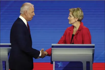  ?? DAVID J. PHILLIP - THE ASSOCIATED PRESS ?? Democratic presidenti­al candidates former Vice President Joe Biden, left, and Sen. Elizabeth Warren, D-Mass., shake hands Thursday, Sept. 12, 2019, after a Democratic presidenti­al primary debate hosted by ABC at Texas Southern University in Houston.