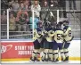  ?? PETE BANNAN — MEDIANEWS GROUP ?? West Chester Rustin players celebrate Aiden Harris’ goal to open the scoring against Unionville Wednesday.