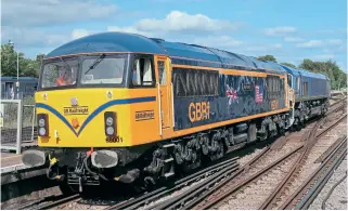  ?? Spencer Conquest ?? RIGHT: On
August 11, GB Railfreigh­t 69001
Mayflower hauls 66796 through Basingstok­e, while working from Longport to Eastleigh Works to deliver the Class 66 to Arlington Fleet Group for repainting.