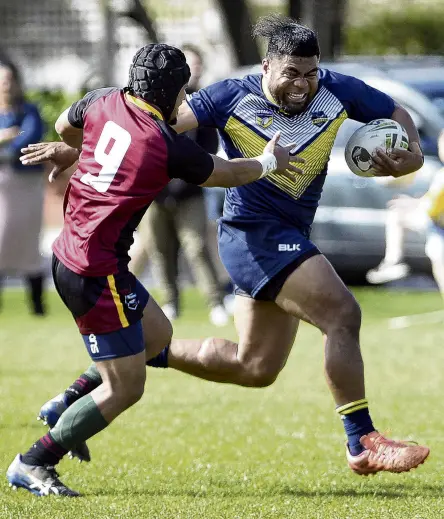  ?? PHOTO: GERARD O’BRIEN ?? Excuse me, coming through . . . Otago centre Sione Fa’aoso tries to elude the tackle of Southland hooker Anisoni Kaufononga at the North Ground on Saturday.