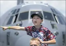  ?? Steph Chambers/Post-Gazette photos ?? Noah Lushko, 9, of Johnstown watches planes fly over.