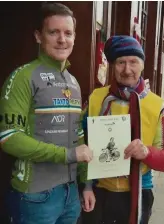  ??  ?? Larry Clarke makes a presentati­on to Graham Macken at the start of the 24 Hour Roller Cycle for the ARC Cancer Support Centre