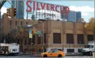  ?? AP PHOTO/MARK LENNIHAN ?? Traffic passes Silvercup Studios, a film and television production facility, located in Long Island City near the site for a proposed Amazon headquarte­rs in the Queens borough of New York on Friday.