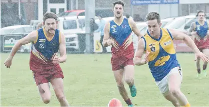  ??  ?? Warragul Industrial­s player Josh Seri and Ellinbank player Jackson Parker race for possession.