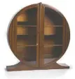  ?? [COWLES SYNDICATE INC.] ?? This unusual round cabinet sold at an Ohio auction for $450.