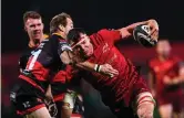  ?? EÓIN NOONAN/ SPORTSFILE ?? Munster’s Robin Copeland is tackled by Sarel Pretorius of Dragons at Irish Independen­t Park last night