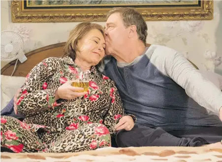  ??  ?? Roseanne Barr and John Goodman in a scene from this month’s finale of the revived, and now cancelled, sitcom Roseanne.