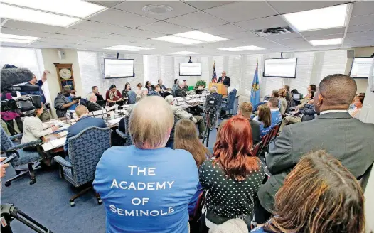  ?? [PHOTO BY STEVE GOOCH, THE OKLAHOMAN] ?? An overflow crowd shows support Thursday for The Academy of Seminole during a state school board meeting in Oklahoma City.