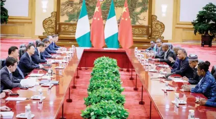  ??  ?? President Muhammadu Buhari (2nd right) with his team at a meeting with Chinese President Xi Jinping (2nd left) with his team, in Beijing, China yesterday Photo: State House