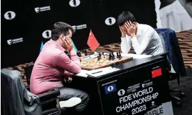  ?? ?? Ding Liren (right) ponders his next move in game seven which opponent, Ian Nepomniach­tchi, won after China’s world No 3 collapsed under time pressure. Photograph: Stev Bonnage/Fide