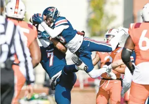  ?? PAIGE DINGLER/AP ?? Liberty wide receiver Noah Frith catches a pass against Virginia Tech during Saturday’s game in Lynchburg.