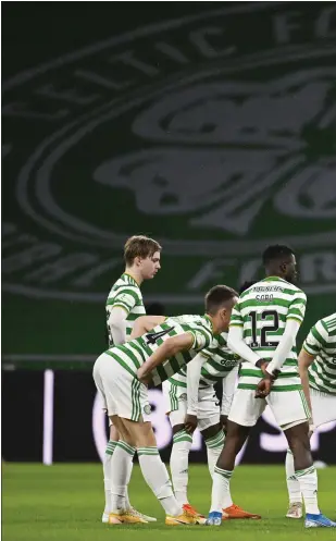  ??  ?? Celtic’s Huddle was socially distanced against Hibs on Monday, and Callum McGregor (left) hopes it isn’t permanent