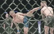  ?? Mike Stobe Getty Images ?? T.J. DILLASHAW, left, knocked out Cody Garbrandt last November to win the bantamweig­ht title.