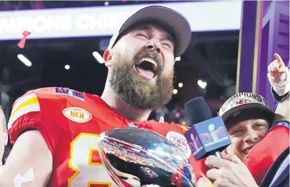  ?? Picture: AFP ?? PURE ECSTASY. Kansas City Chiefs tight end Travis Kelce holds the Vince Lombardy trophy next to quarterbac­k Patrick Mahomes after they beat the San Francisco 49ers at Super Bowl LVIII in Las Vegas.