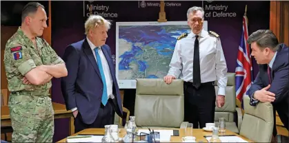  ?? ?? BRIEFING: Lieutenant General Charles Stickland, left, and Admiral Sir Tony Radakin, third from left, keep Boris Johnson and James Heappey up to speed about the situation in Ukraine during a meeting at the Ministry of Defence