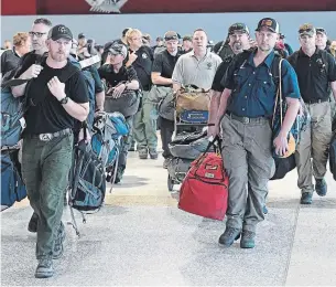  ?? JULIAN SMITH THE ASSOCIATED PRESS FILE PHOTO ?? The first group of 21 experts left for Australia in early December, and returned to Canada last week. The latest wave will spend 31 days, all of it in the state of Victoria. Previous groups were deployed to other parts of the country, including Sydney.