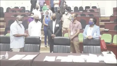  ??  ?? President David Granger (second from left) in the tabulation centre for the national recount of votes