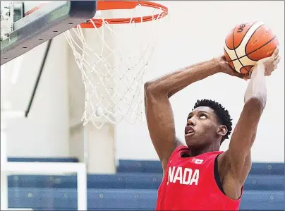  ?? CP PHOTO ?? R.J. Barrett dunks the ball during an U19 basketball Canada team practice in Mississaug­a, Ont. on June 20.