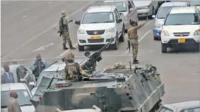  ??  ?? Military vehicles and soldiers patrol the streets in Harare, Zimbabwe, November 15, 2017. PHILIMON BULAWAYO/REUTERS