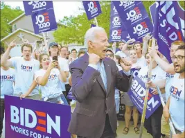  ?? John Locher The Associated Press ?? Democratic presidenti­al candidate and former Vice President Joe Biden meets with supporters Friday at the Iowa Democratic Wing Ding in Clear Lake, Iowa.