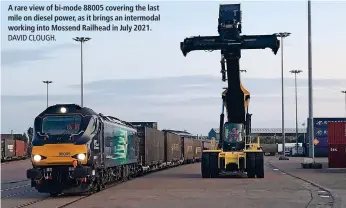  ?? ?? A rare view of bi-mode 88005 covering the last mile on diesel power, as it brings an intermodal working into Mossend Railhead in July 2021.