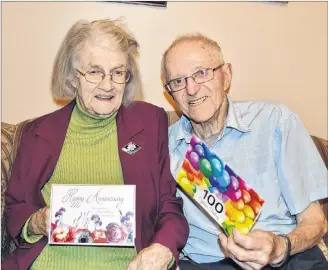  ?? ERIC MCCARTHY/JOURNAL PIONEER ?? Jean and Ted Hudson sort through some of the anniversar­y and birthday cards they’ve received. The Cascumpec couple was married on Sept. 18, 72 years ago, and Ted turned 100 on Sept. 21.