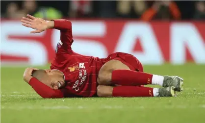  ??  ?? Liverpool’s Fabinho reacts after injuring an ankle against Napoli. Photograph: Carl Recine/Action Images via Reuters