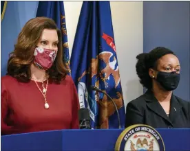  ?? MICHIGAN OFFICE OF THE GOVERNOR VIA AP, FILE ?? Governor Gretchen Whitmer, left, speaks as Michigan Department of Health and Human Services Chief Medical Executive, Dr. Joneigh Khaldun, listens in Lansing, Tuesday, Feb. 9, 2021.