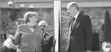  ?? MURAD SEZER / REUTERS ?? German Chancellor Angela Merkel and Turkish President Recep Tayyip Erdogan chat before their meeting in Istanbul on Saturday.