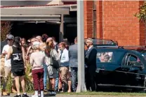  ??  ?? Mourners gather outside the service for Amber-Rose Rush, in Dunedin yesterday.