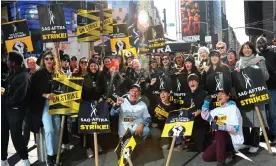  ?? Photograph: Jose Perez/Bauer-Griffin/GC Images ?? Picketers are seen at the Sag-Aftra picket line in Times Square, New York on 8 November 2023.