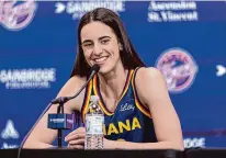  ?? Michael Hickey/Getty Images ?? Fever rookie Caitlin Clark speaks to the media on May 1 in Indianapol­is.