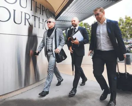  ??  ?? Jayden Moorea, aka Dan Shearin, left, with his legal team front the Southport Courthouse for Day 3 of the committal hearing into the death of Breeana Robinson. Picture: Scott Powick