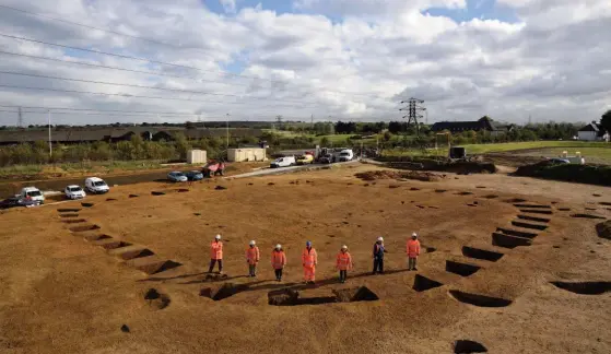  ??  ?? Above: The field team half way through the dig, looking east