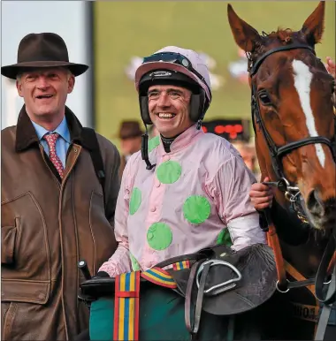  ??  ?? Trainer Willie Mullins, left, and jockey Ruby Walsh smile to the crowd in the winners’ enclosure after winning the Trull House Stud Mares Novices’ Hurdle with Limini. Prestbury Park, Cheltenham, Gloucester­shire, England. Picture credit: Seb Daly /...