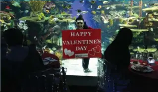  ??  ?? Divers will be in the tanks during the soirée, which will include special Valentine’s Day-themed dive shows and fun food that includes things like a doughnut wall and a Steamwhist­le cheese fondue bar, says Amanda Blenkhorn, director of education,...