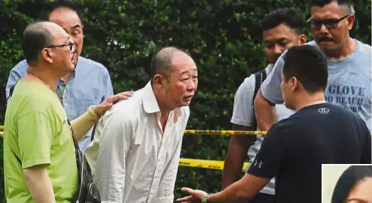  ?? — ZHAFARAN NASIB/ The Star ?? Devastated: Lee’s (inset) husband Siak Kum Guan, 51, (in off-white shirt) trying to come to terms with the news of his wife’s fatal shooting.
